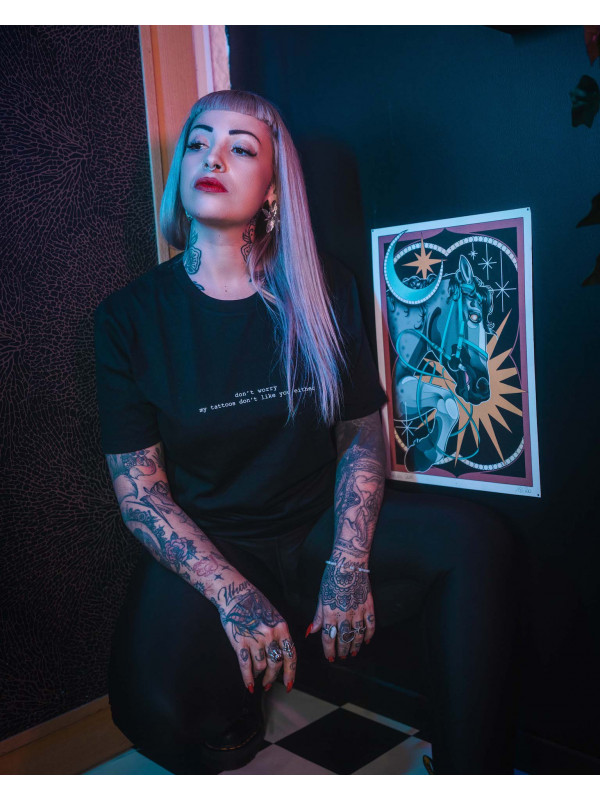 Cécile wears the 'My Tattoos Don't Like You' tee for men and women by swiss streetwear brand bastonnade clothing.